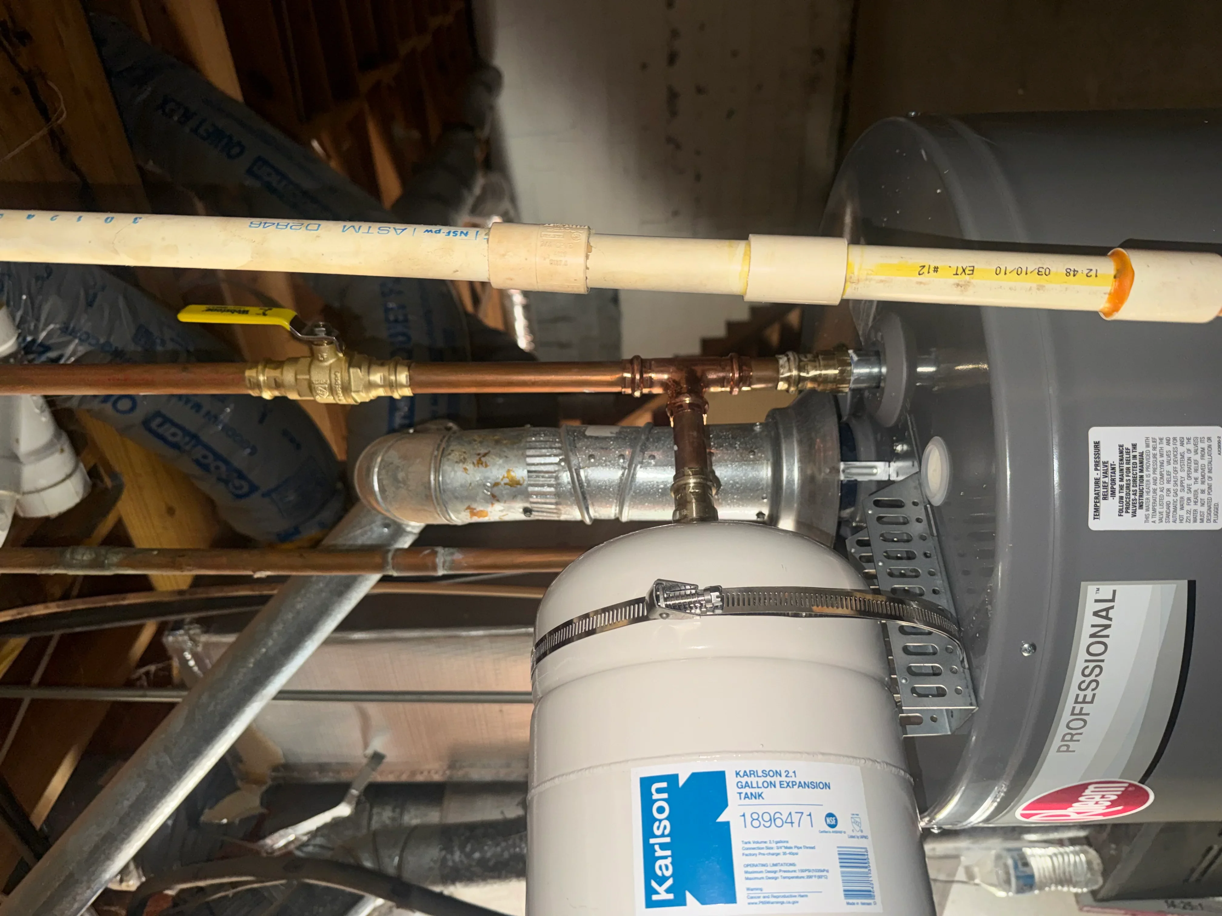 Karlson expansion tank installed with copper piping and brass valves on water heater system